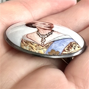 Motiwala enamel button of Queen Elizabeth II and commemorative card with tassel.