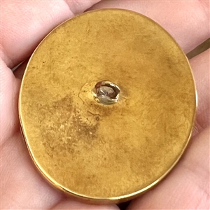 Caramel glass button of a rose.