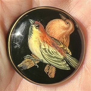 Russian lacquer button of two birds.