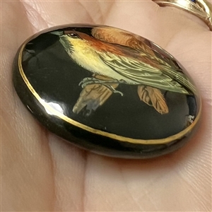 Russian lacquer button of two birds.
