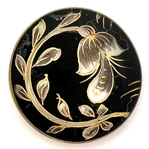 Flower and leaves reverse painted on glass over iridescent celluloid set in metal button.