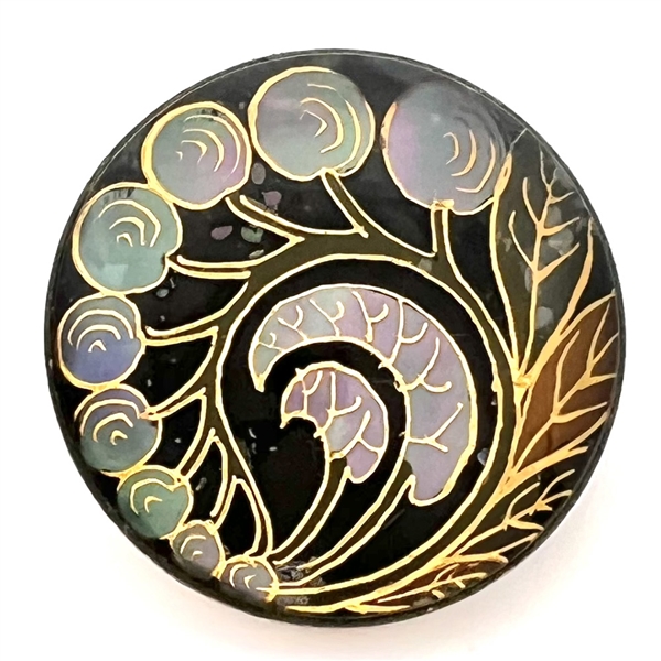 Berries and leaves reverse painted on glass over iridescent celluloid set in metal button.