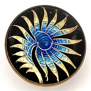 Fern-like design reverse painted on glass over gold and blue lusters set in metal button.