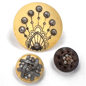 Three Victorian buttons with steels - largest is celluloid.