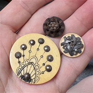 Three Victorian buttons with steels - largest is celluloid.