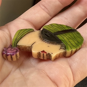 Realistic plastic button of a “Flapper head.