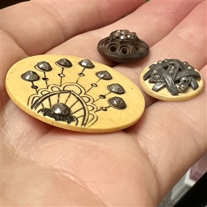 Three Victorian buttons with steels - largest is celluloid.