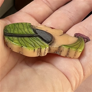 Realistic plastic button of a “Flapper head.