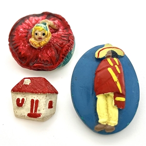 Three Vintage assorted painted plaster buttons.
