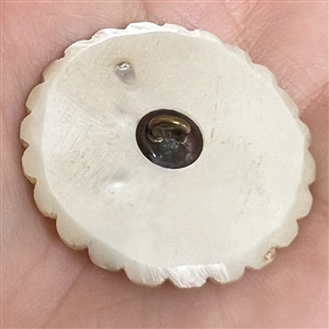 An 18th c. pearl with scalloped edge.
