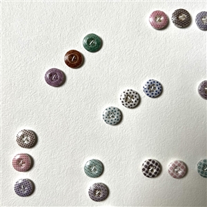 Card of forty two small china calico buttons. 