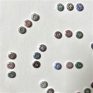 Card of forty two small china calico buttons. 