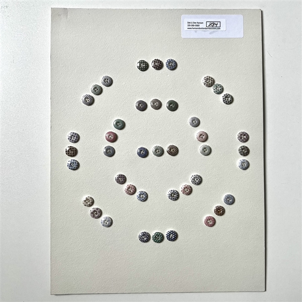 Card of forty two small china calico buttons. 