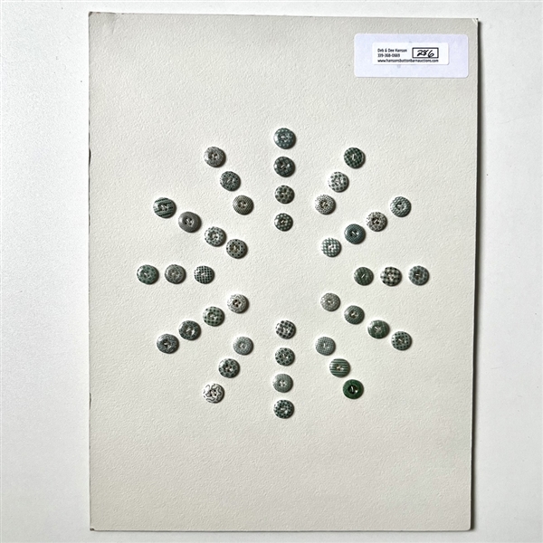 Card of forty two small china calico buttons in green. 