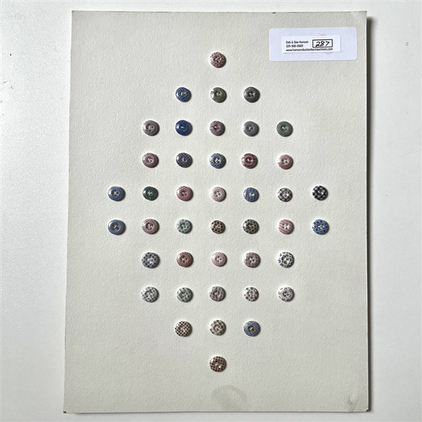 Card of forty two small china calico buttons.