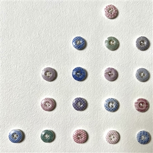 Card of forty two small china calico buttons.