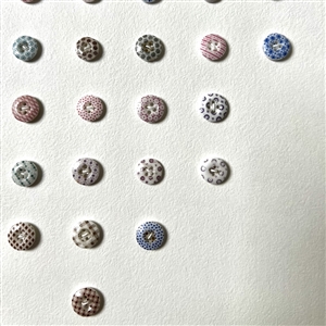 Card of forty two small china calico buttons.