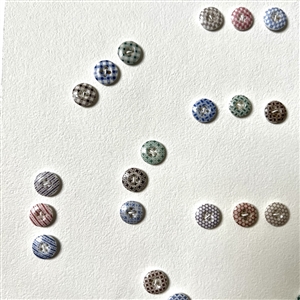 Card of forty two small china calico buttons.