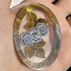 Vintage reverse carved and painted acrylic button of blue roses.