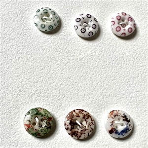 Card of forty two small china calico buttons.