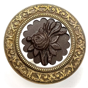 A 19th c. Button with gutta percha rose in steel collet and a detailed brass border.