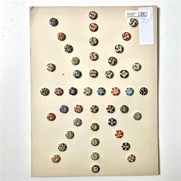 Card of forty five small china stencil buttons.
