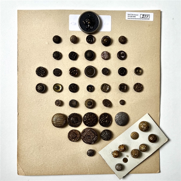 Two cards of forty eight twinkle and early gilt buttons.
