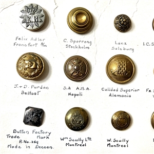 Card of thirty foreign uniform buttons. 