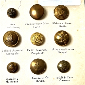 Card of thirty foreign uniform buttons. 