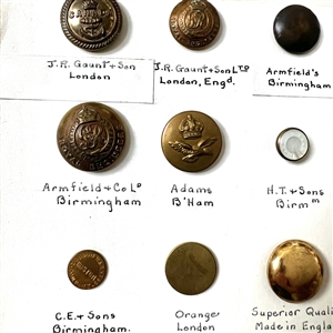 Card of thirty foreign uniform buttons. 
