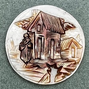A 19th c. Carved pearl button of a woman and buildings. 