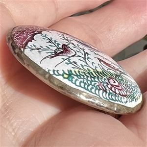 Enamel button of birds in a garden set in silver (?). 