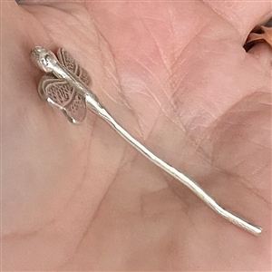 Realistic dragon fly button of unmarked silver.