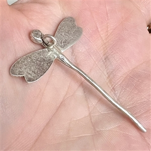 Realistic dragon fly button of unmarked silver.