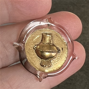 Bimini clear glass button with gold luster of an urn. 