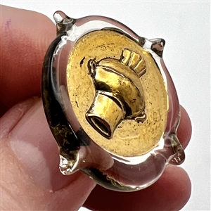 Bimini clear glass button with gold luster of an urn. 