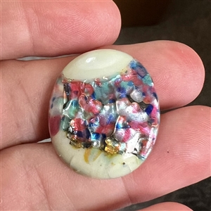 Oval glass button by Leo Popper.