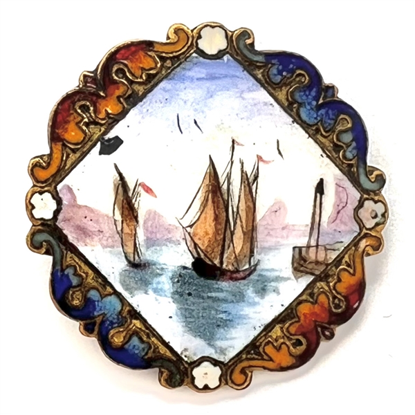 A 19th c. Enamel button of ships in a harbor.