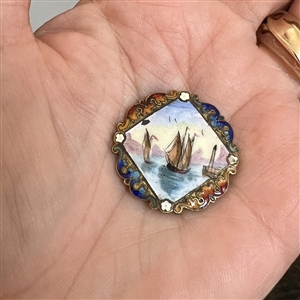 A 19th c. Enamel button of ships in a harbor.