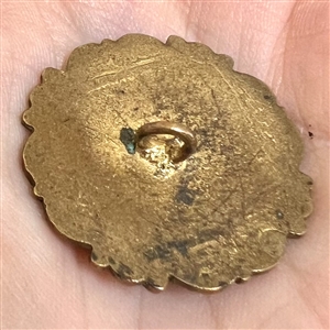 A 19th c. Enamel button of ships in a harbor.