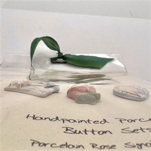 Original store card with three hand-painted porcelain buttons.