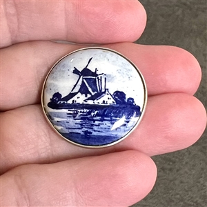 Delft porcelain of a windmill in modern  silver setting.