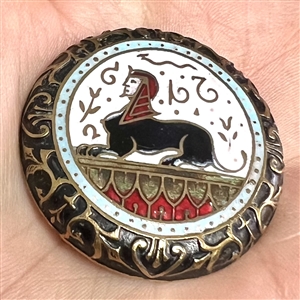 Large enamel button of Egyptian sphinx.
