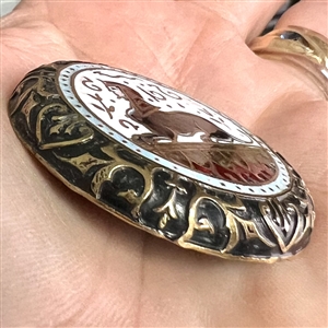 Large enamel button of Egyptian sphinx.