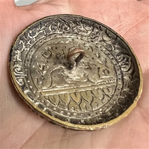 Large enamel button of Egyptian sphinx.