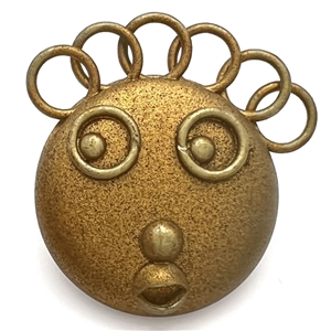 Painted celluloid goofie button of a funny face and crazy hair.