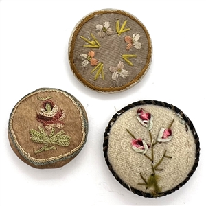 Three 19th c. Fabric buttons of flowers.