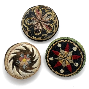Three 19th c. Fabric buttons of flowers and patterns.