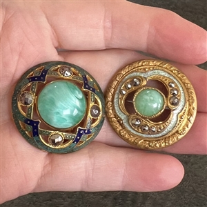 Two imitation gemstone glass in metal buttons with enamel and cut steels.