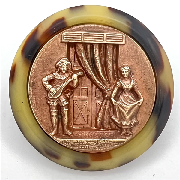 Stamped copper in Vintage plastic (?) scarce button of Scaramouche and Columbine. 